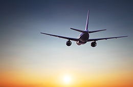 Aeroplane landing at sunset