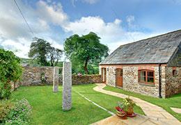 Cottage with garden and stone wall